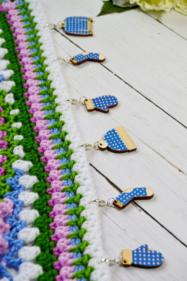 Wooden stitch markers winter woollens used as counting aids on a crochet project Wooden stitch markers winter woollens used as counting aids on a crochet project